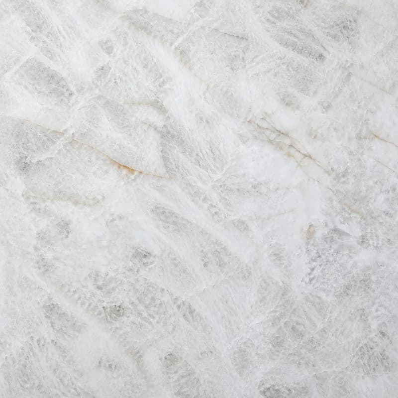 AI material visualization of Cristallo Quartzite with luminous white and pale-gray crystalline movement and restrained warm mineral accents.. AI design visualization.